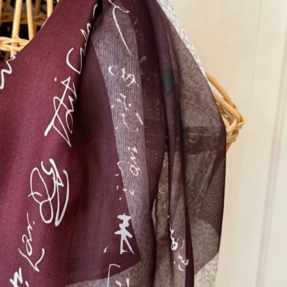 100% silk wine colored and silver oblong scarf.